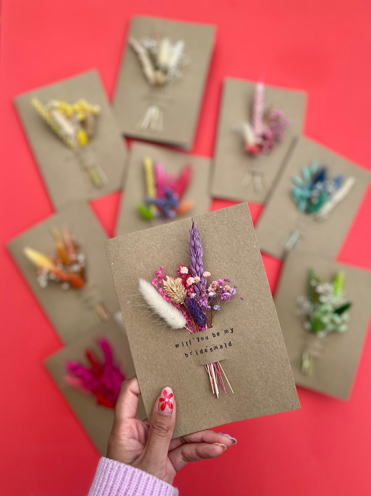 Bespoke handmade cards with dried flowers arranged in a removable slot. Customizable messages for any occasion, turning the card into a lasting keepsake.